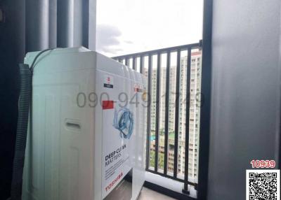 Washing machine on the balcony with city view
