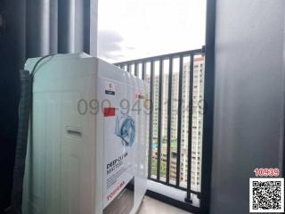 Washing machine on the balcony with city view