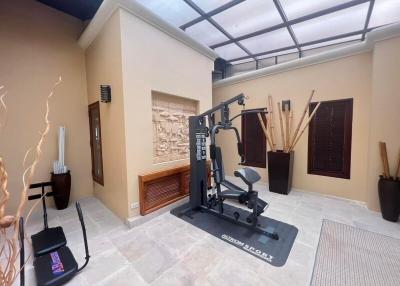 Spacious home gym with modern equipment and decorative elements