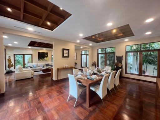 Spacious living and dining area with elegant hardwood floors and ample natural light