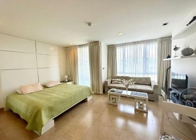 Spacious bedroom with en-suite living area and natural light