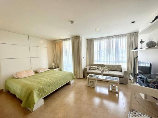 Spacious bedroom with en-suite living area and natural light