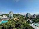 Scenic cityscape view from property showing surrounding buildings and greenery