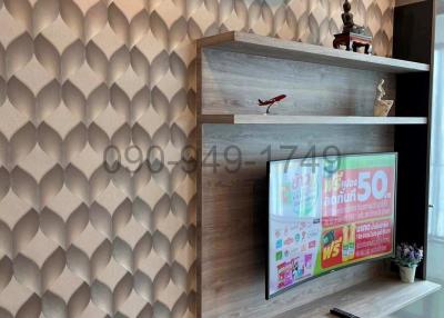 Modern living room interior with unique wallpaper design and wall-mounted TV