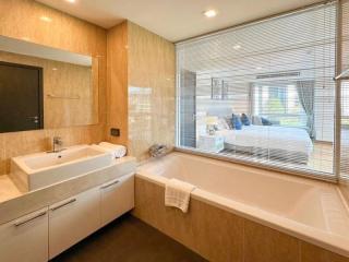 Modern bathroom with large window and bathtub