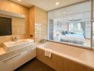 Modern bathroom with large window and bathtub