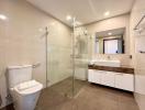Modern bathroom with glass shower and double vanity