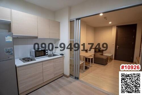 Modern kitchen with stainless steel appliances and open floor plan