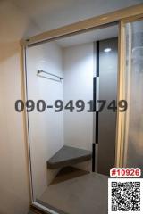 Compact bathroom with shower and seating area