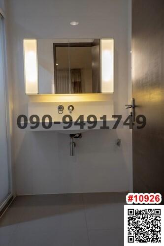 Modern bathroom interior with well-lit vanity mirror