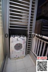 Compact balcony with air conditioning outdoor unit and louvred privacy wall