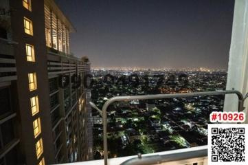High-rise apartment balcony with city night view
