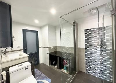 Modern spacious bathroom with glass shower and sleek design