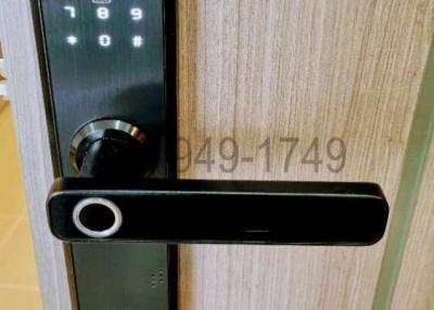 Modern digital lock on a wooden door