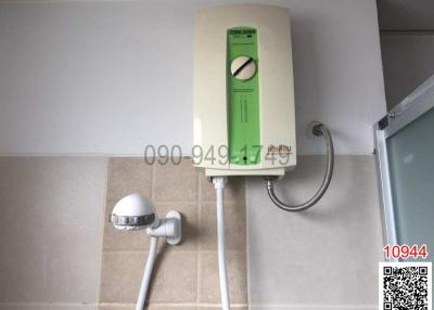Compact bathroom with wall-mounted electric water heater