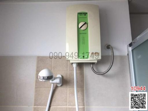 Compact bathroom with wall-mounted electric water heater