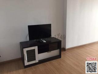 Minimalist living room with television set and parquet flooring