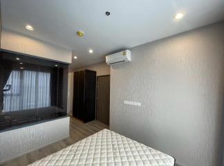 Spacious and modern bedroom with ample lighting