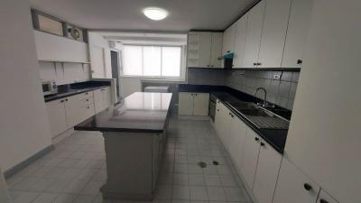 Spacious modern kitchen with ample countertops and natural light