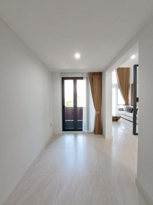 Modern empty building interior with shiny tiled floors and natural light