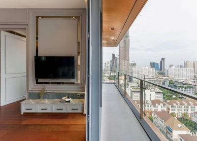 Modern living area with city view through floor-to-ceiling windows