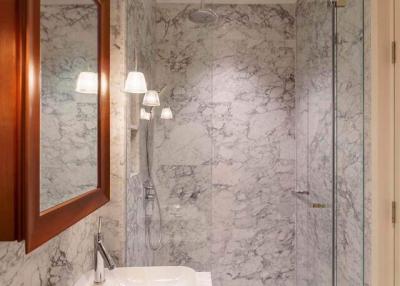 Modern bathroom with marble walls and flooring