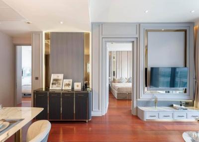 Elegant living room interior with connected dining area and adjacent bedroom view