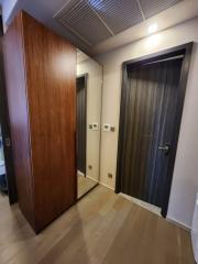 Elegant wooden-floored corridor with modern doors