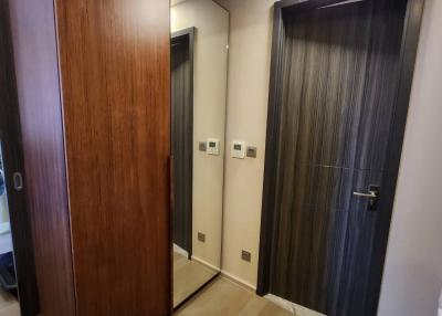Elegant wooden-floored corridor with modern doors