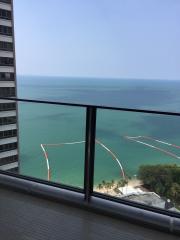 High-rise balcony overlooking ocean with a clear view and safety railing