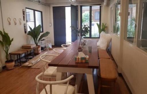 Spacious dining room with long wooden table and modern chairs