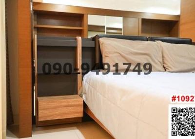 Cozy Bedroom with Large Bed and Built-In Wardrobe