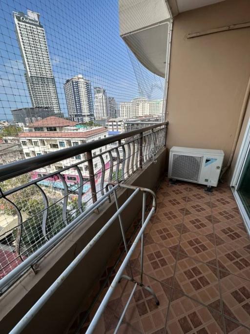 Spacious balcony with city view and tiled flooring