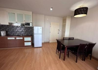 Spacious kitchen with modern appliances and dining area