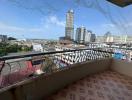 Spacious balcony with city view and tiled flooring