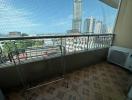 Spacious balcony with city view and floor tiling