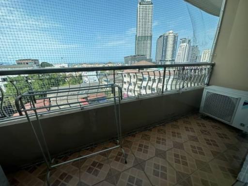 Spacious balcony with city view and floor tiling