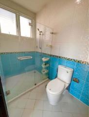 Modern bathroom with white and blue tiles