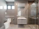Modern bathroom with glass shower and neutral tones