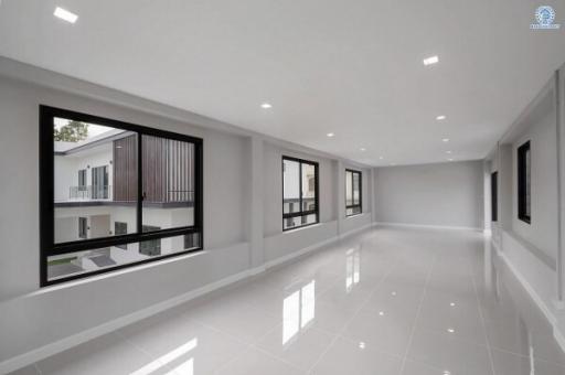 Spacious and well-lit empty interior space of a modern building with large windows