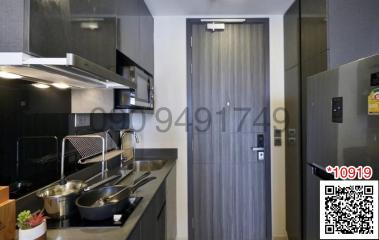 Modern compact kitchen with stainless steel appliances