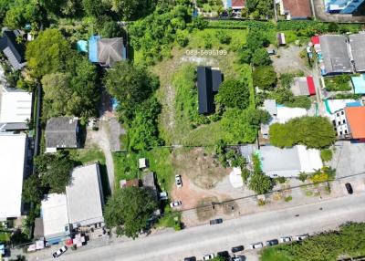 Aerial view of a property lot with surrounding neighborhood