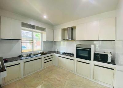 Spacious kitchen with modern appliances and ample cabinetry