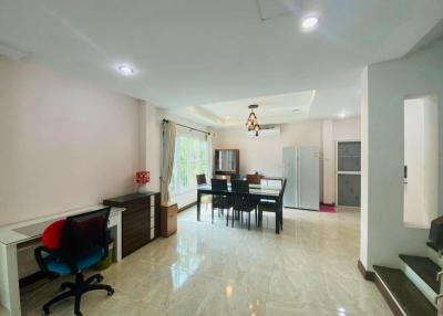 Spacious living room with dining area and office corner