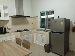 Modern kitchen with stainless steel appliances and white cabinetry