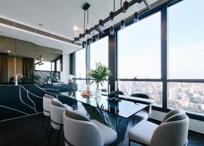 Modern dining area with cityscape view through large windows