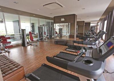 Modern home gym with various exercise equipment