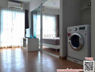 Modern bedroom with large windows and in-suite laundry