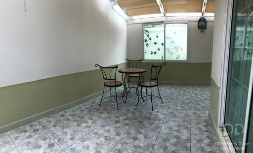 Bright and airy sunroom with a small table and chairs set