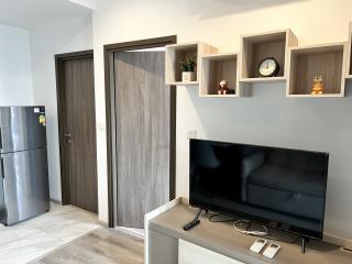 Modern living room with television and decorative shelving